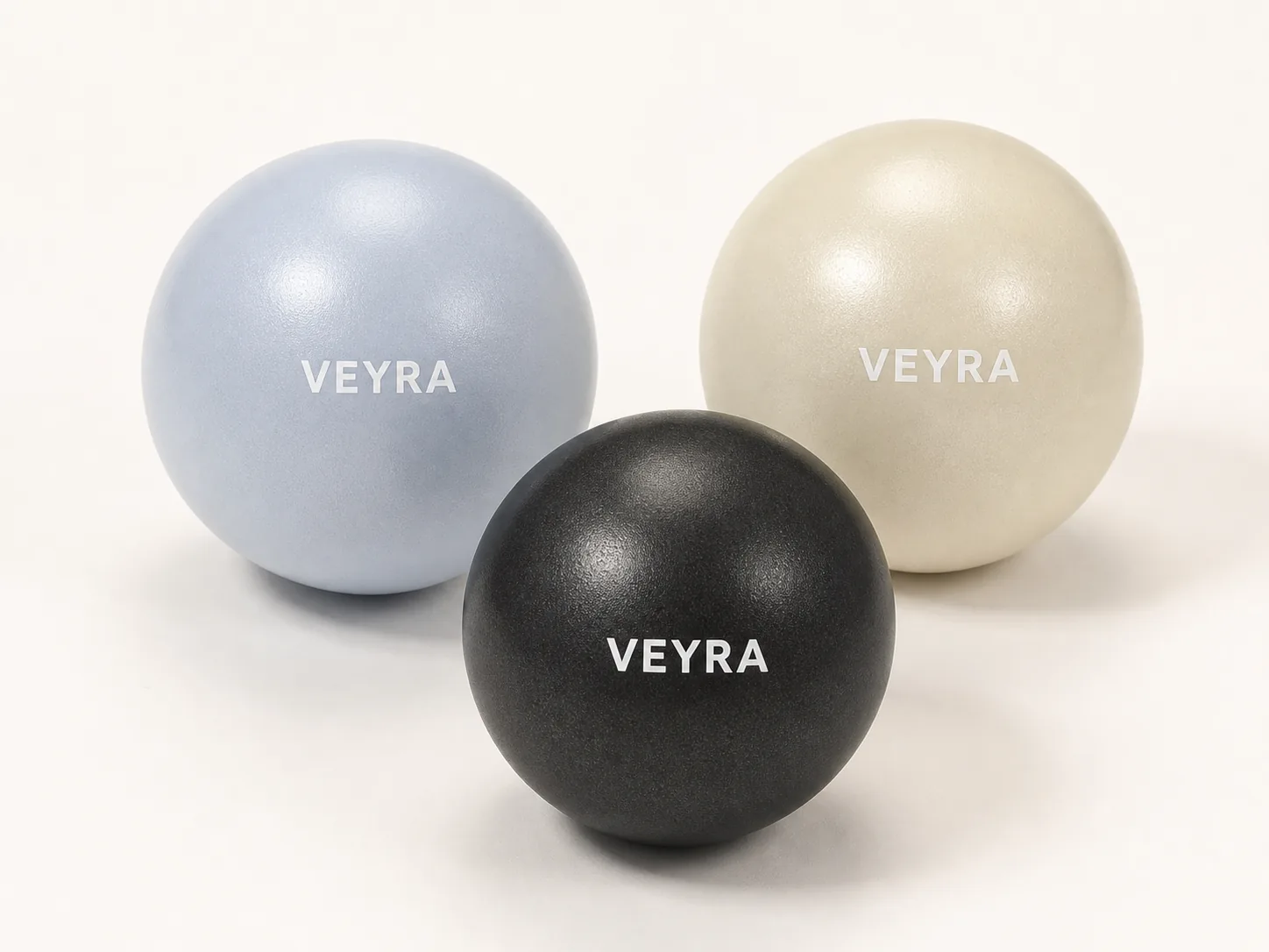 The VEYRA Pilates Ball in powder blue, cream and charcoal
