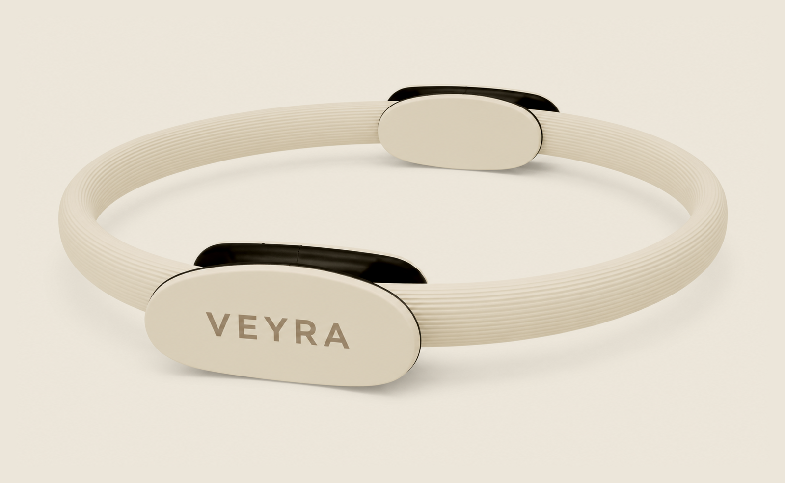 The cloud-cream VEYRA Pilates Ring with dual padded handles